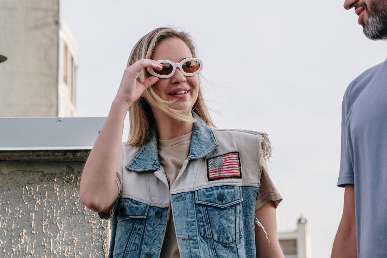 Young adults enjoying a casual day on a rooftop, embodying summer vibes and friendship.